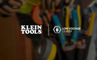 Laborer wearing toolbelt carrying Klein Tools