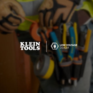 Laborer wearing toolbelt carrying Klein Tools