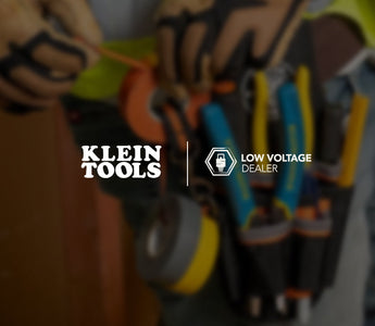Laborer wearing toolbelt carrying Klein Tools