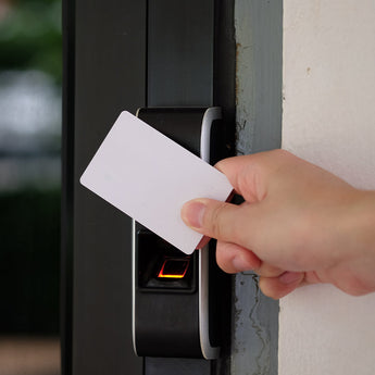 Person using key card on an access control terminal