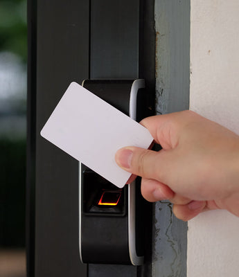 Person using key card on an access control terminal