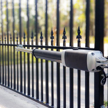 Black and silver gate operator hardware arm with black gate