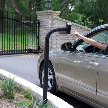 Black gate operator mount keypad with tenant reaching out in beige car