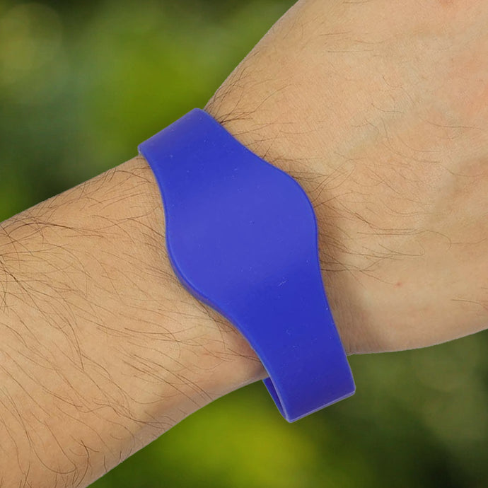 man wearing a blue rfid bracelet