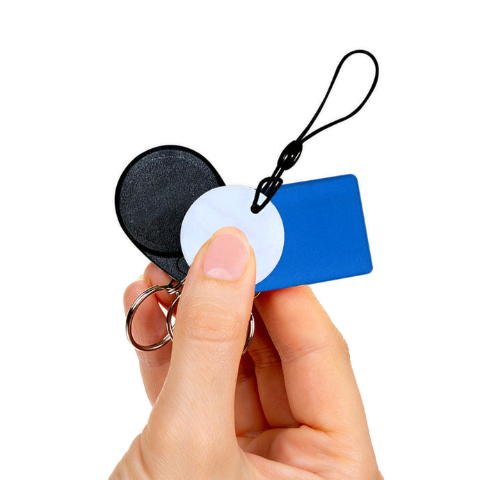 person holding sets of key fobs