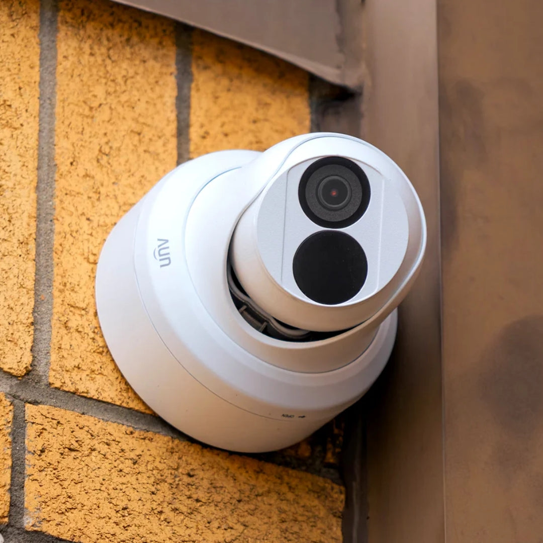 UNV turret camera installed outside on brick wall