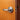 silver storeroom lock on wooden door with door stopper behind
