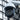 white cctv ptz camera with mount outside cityscape